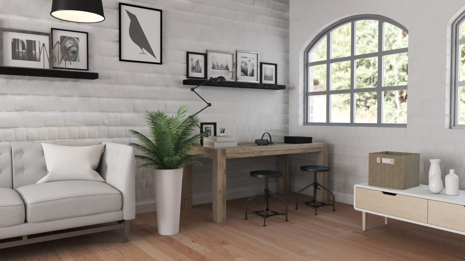 Un arredamento home office di stile contemporaneo. scrivania in legno con due sgabelli neri; un divano; una pianta; quadri minimalisti. si intravede un giardino dalla finestra.